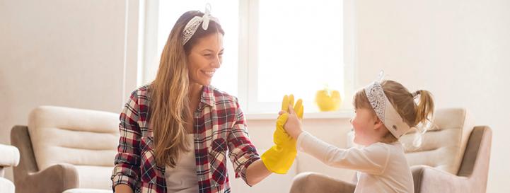 Parent and child celebrating after cleaning