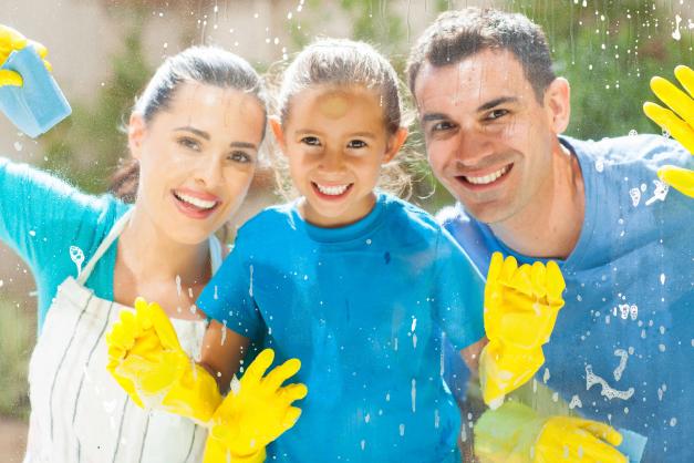 Family cleaning windows