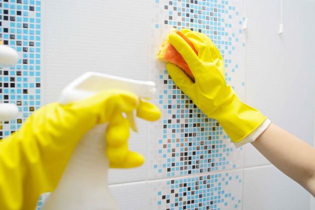 Washing the bathroom tiles